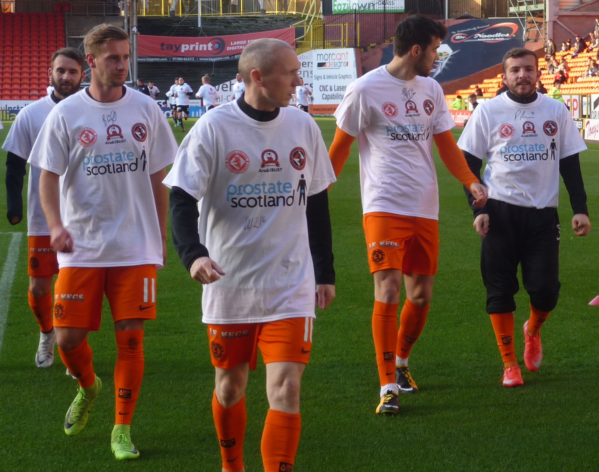 Dundee United warming up in Prostate Scotland t shirts