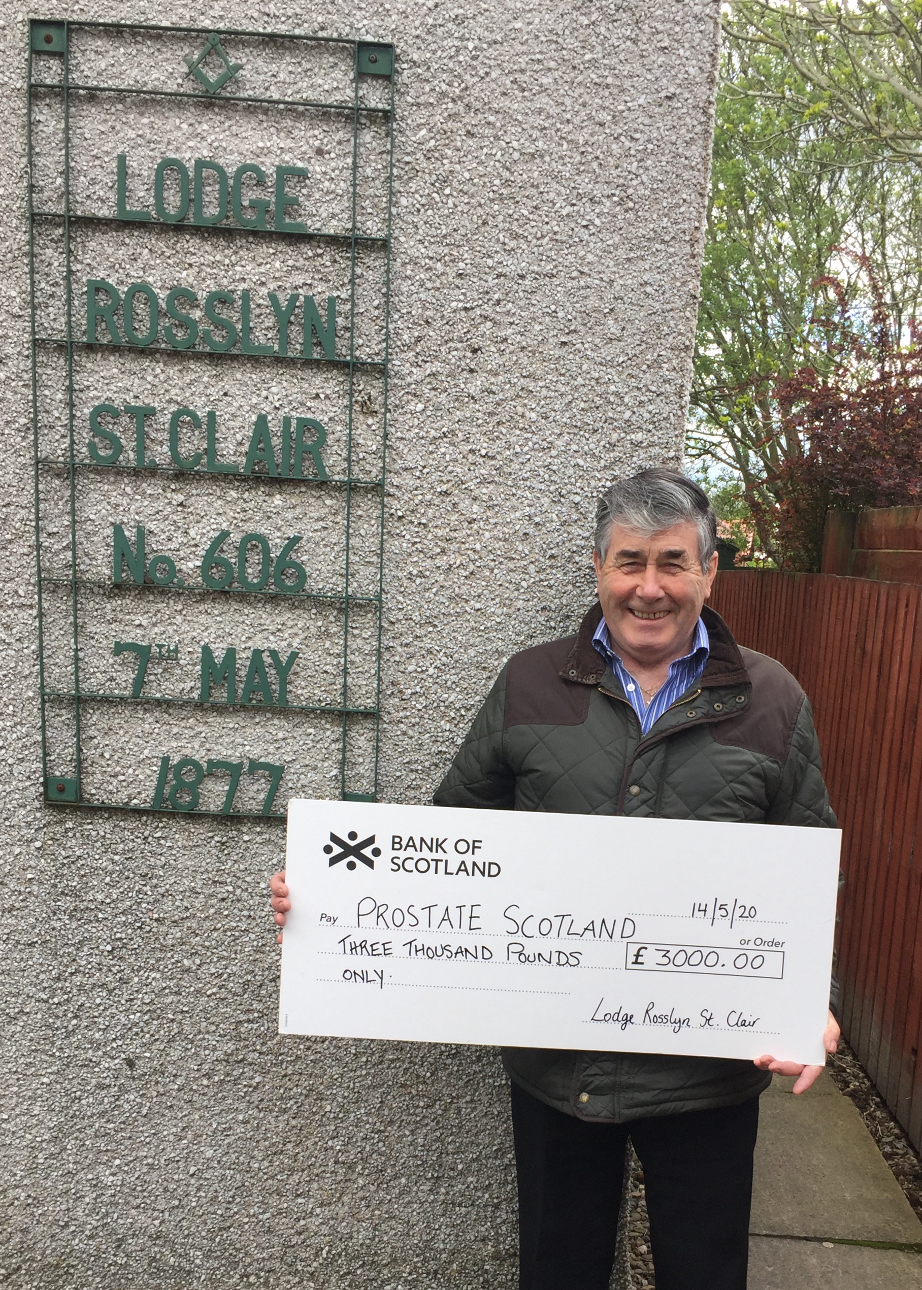 Alex Barrett presenting cheque to Prostate Scotland