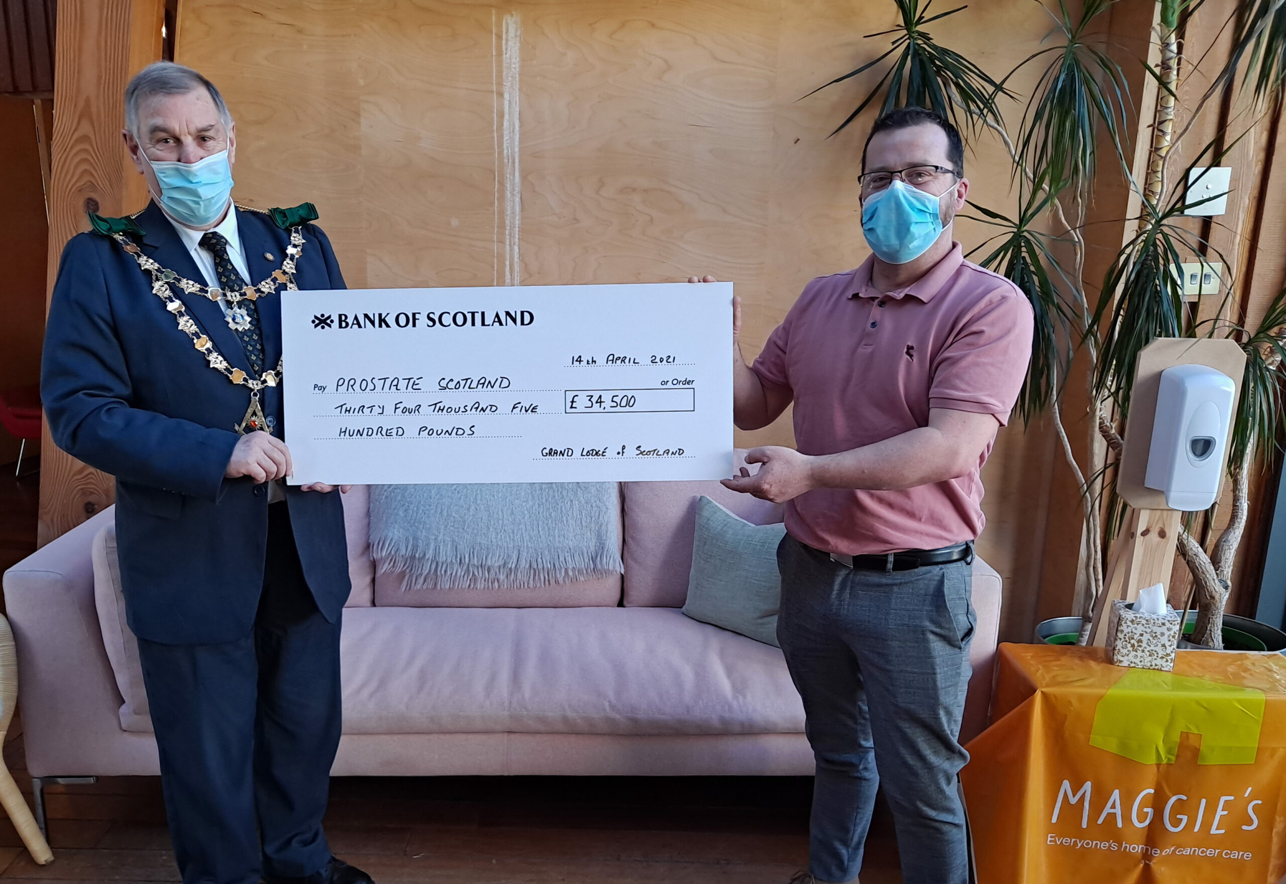 The Grand Master Mason presenting a cheque for £34,500 for Prostate Scotland to Brian Corr